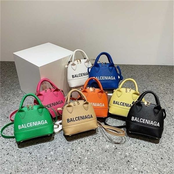 Pontos de folga bolsas on -line bolsas modernas tendência de concha de estilo estranho cor brilhante feminina vendas de bolsas