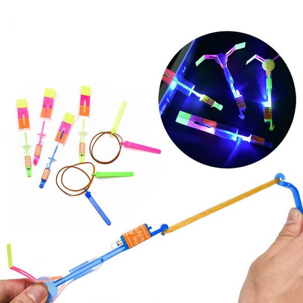 Slingshot Spielzeug Erstaunliche Pfeilhubschrauber Gummi -Band Power Copter Kids LED Flying Toy 100% Marke