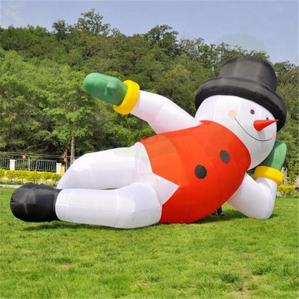 Personaggio invernale personalizzato con pupazzo di neve gonfiabile e palloncino gonfiabile con decorazione natalizia sdraiato con cappello rosso per gli Stati Uniti