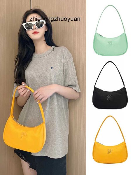 2023 Novo designer feminino Korean China Fashion Marca NY Small Fresh Liquid Bag Versátil Girls Meninas Bolsa de Irmãs