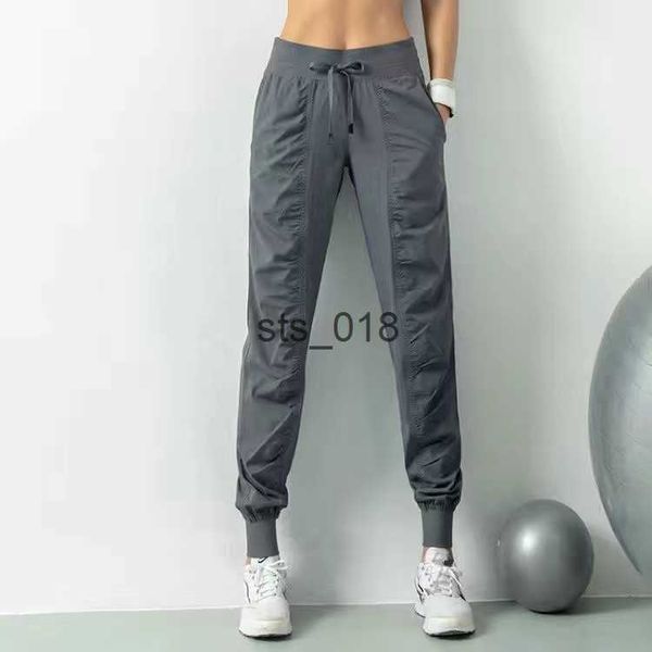 Yoga Outfit LL Women Yoga Jogging Calça solta Sweatpantes de fitness femininos corredores correndo com calças de moletom de estiramento T230228