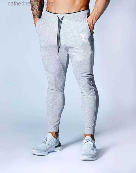 Pantaloni da uomo Nuova primavera e autunno Palestra Fitness Uomo da corsa Slim Zipper Feet Pantaloni casual Moda uomo Sport Pantaloni da allenamento in cotone grigio T230602