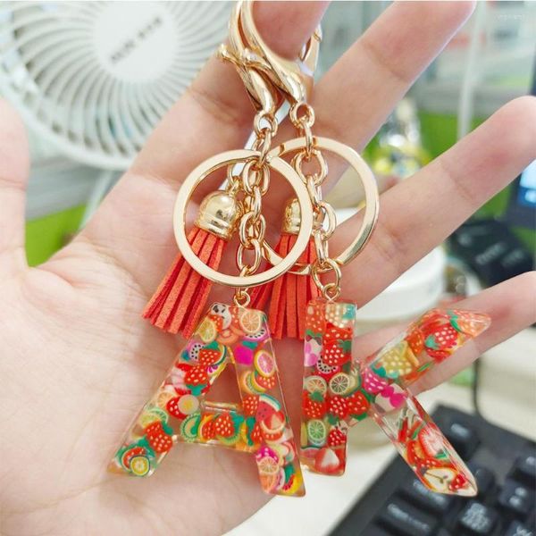 Keechhains 26 lettere luminose in resina di frutta keychain women borse di moda ornamenti con tassel regalo chic chic.