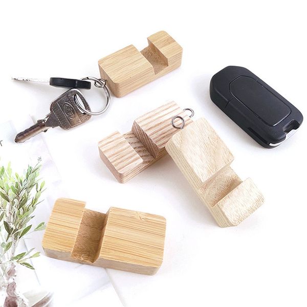 Suporte de telefone celular de madeira de bambu com design leve e fino Anel pingente com suporte universal para telefone de mesa