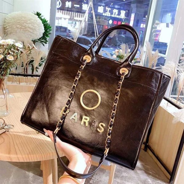 Borse da donna di lusso Borse da spiaggia Designer Lettera in metallo Distintivo Tote Borsa da sera Borsa piccola in pelle Borsa grande Portafoglio a catena femminile Zaino 60% Vendita outlet