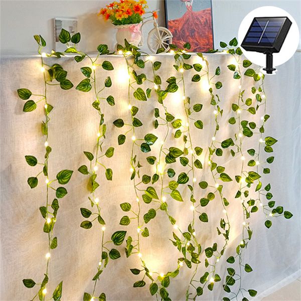 Luzes de fada solar, 33 pés 100 LED Luzes de corda de videira solar, branco quente 8 modos de plantas de folha artificial verde Guirlanda de videira, decoração de parede de jardim de festa de casamento