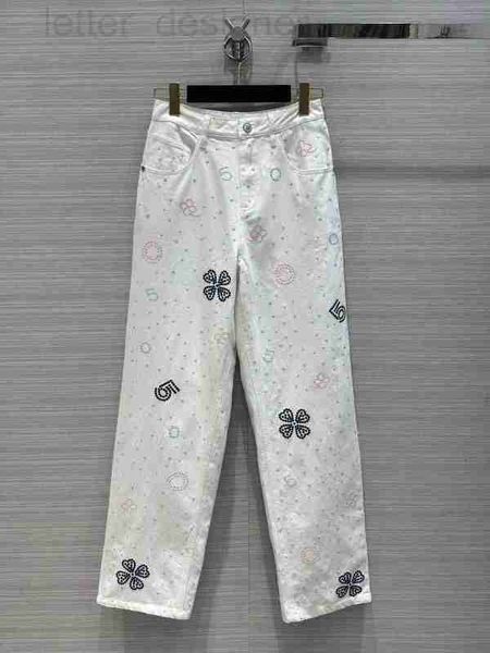Женские джинсы дизайнер роскошный 2023 модный дизайн -дизайн улица Wear Wear The Neg Denim брюки женщины белые кнопки с высокой талией.