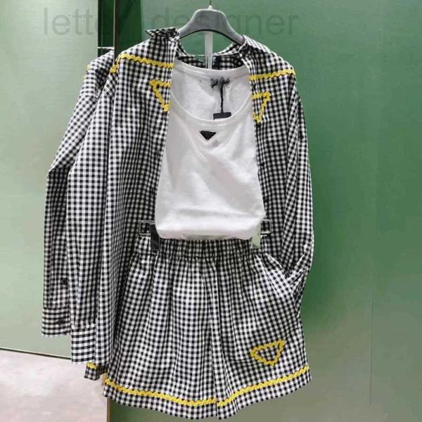 Blusas femininas camisas de grife Wave Edge Ribbon emendado camisa de manga comprida verão novo padrão xadrez moda idade redução solto relaxado KR2A