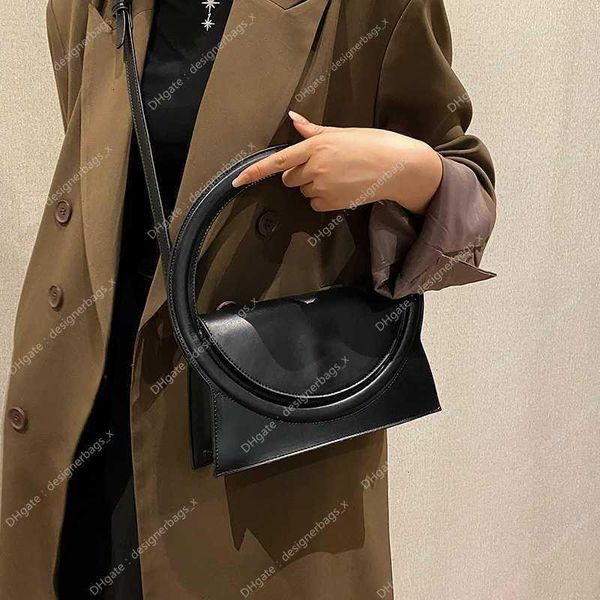 Borse borse Top Cheap 2024 Femme Store Marca 90% per le donne Off Sac Moda all'ingrosso Frizione Grande manico rotondo Pu Bag Design di lusso In pelle Lady Crossbody Shuolder