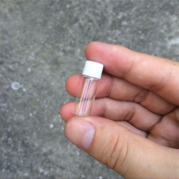 1ml Mini Bottiglie di vetro Fiale Tappo di plastica bianco Vuoto Vasi di bottiglia di vetro trasparente Tappo a vite 10 * 28 * 6mm Commercio all'ingrosso 100 pezzi Xkbvx