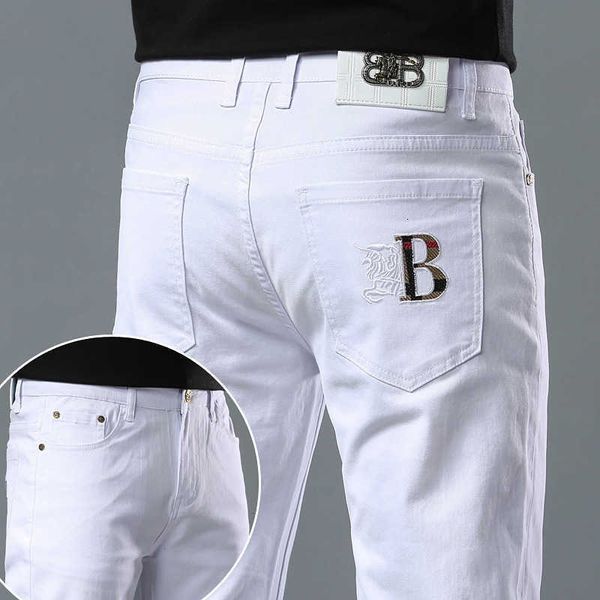 Jeans masculino designer designer 2023 primavera e verão jeans masculino leve luxo versão coreana elástico fino fino algodão calças brancas puras