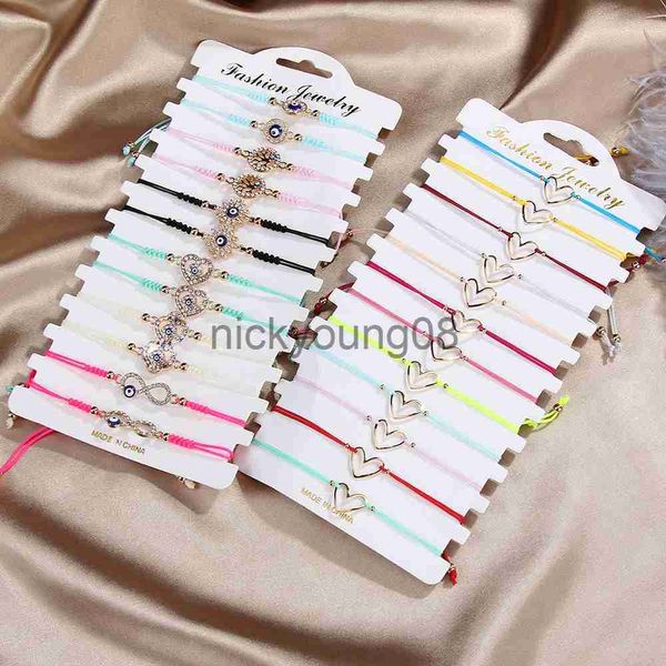 Braccialetti con ciondoli 12 Pz / lotto Braccialetti intrecciati a cuore cavo per le donne Ragazza Cristallo Malocchio fatto a mano Sottile Stringa Braccialetto di corda Gioielli per feste x0627