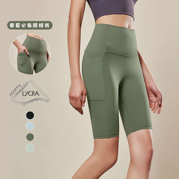 Primavera ed estate Nuovo Qcfe Lycra Nessuna linea di imbarazzo Esercizio di sollevamento dell'anca Fiess Yoga Leggings sportivi tascabili a vita alta per le donne