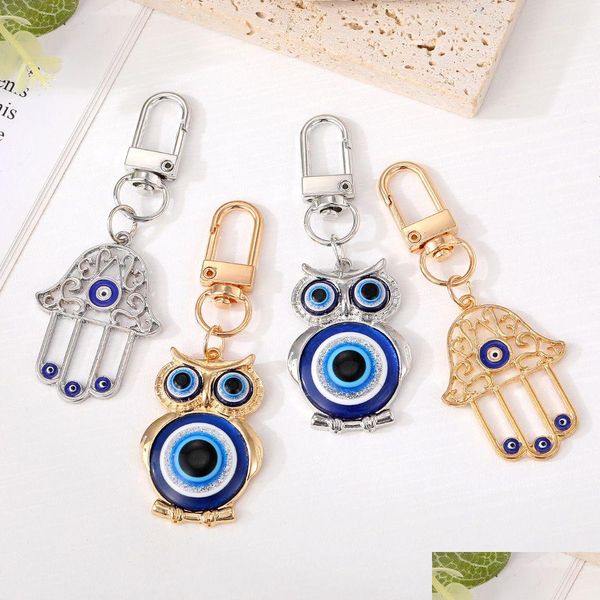 Portachiavi Evil Eye Hamsa Mano Gufo Portachiavi Anello per donna Uomo Hollow Fatima Borsa blu Accessori auto Consegna di gioielli Dhgarden Dhrxd