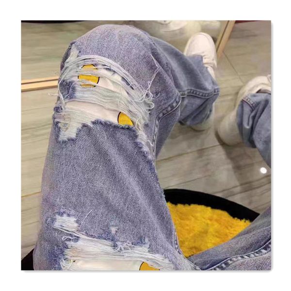 Jeans masculinos Fashin Designer Mens Jeans com buracos azuis sorrindo rosto padrão calças na moda homens esportes versátil casual magro longo outono