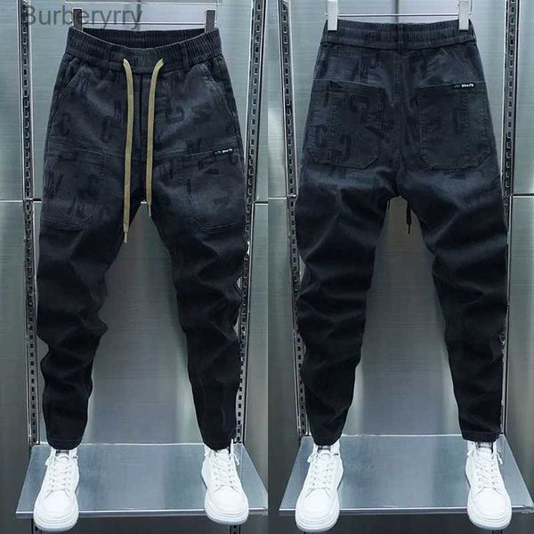 Jeans da uomo Jeans cargo neri Pantaloni skinny harem Pantaloni sportivi da jogger slimline da esterno Stampa di lettere Abbigliamento di marca streetwear di alta qualitàL231011