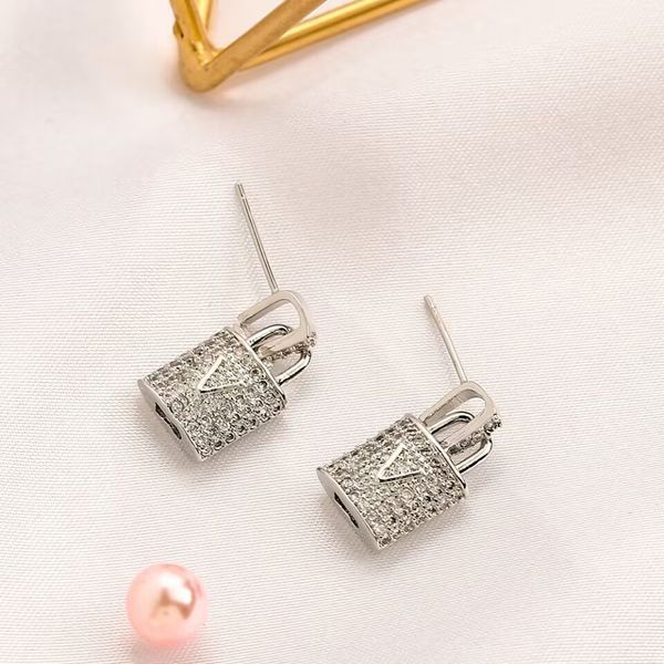 Diamant-Ohrstecker mit Schloss-Anhänger, Halskette, Designer für Damen, passend zu berühmten baumelnden Orecchini-Ohrringen aus vergoldetem Silber, modern und modisch, zb083