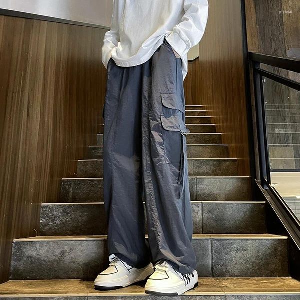 Erkek pantolon Amerikan büyük cep alet tulum yaz gündelik gevşek geniş bacaklı spor yakışıklı düz-bacaklı erkek kıyafetler