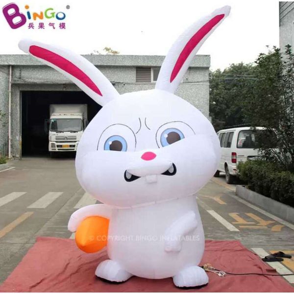 Coelho branco animal inflável gigante ao ar livre de 3 alturas segurando personagem de desenho animado de cenoura para publicidade de eventos Decoração de Páscoa com ventilador de ar brinquedos esportes