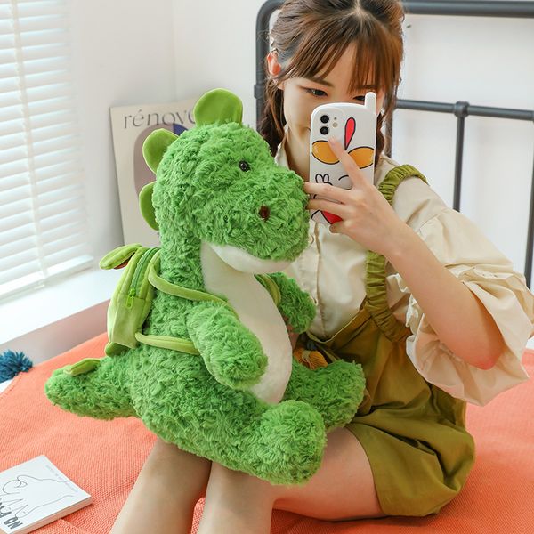 Nova mochila verde dos desenhos animados dinossauro brinquedo de pelúcia boneca dinossauro mascote troca fabricante atacado