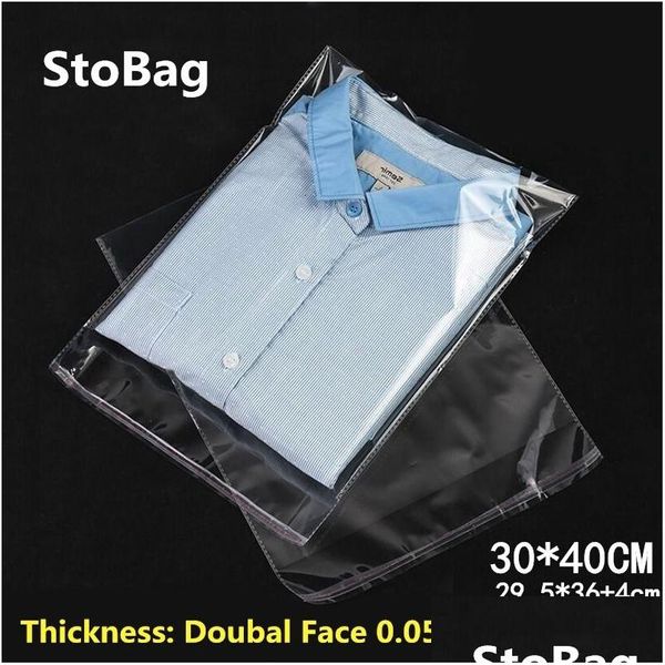 Envoltório de presente Envoltório de presente Stobag 100 pcs 30x40cm Transparente Autoadesivo Plástico OPP Resealable Poli Celofane Roupas Sacos Cle Dhgarden DHD4M