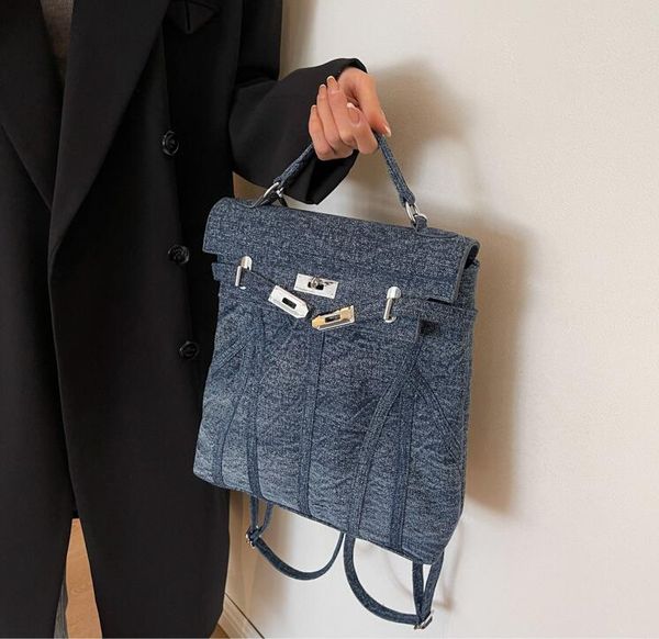 borsa a tracolla da donna 3 colori zaino in denim morbido e spesso di grande capacità borsa in tela con cuciture stile college i popolari zaini moda con fibbia di quest'anno 6252 #