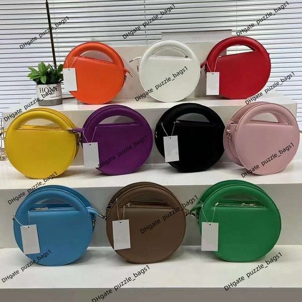 Bolsa de designer bolsa ombro bolsa de ombro elegante nova feminina feminina de couro clássico monocromático redondo portátil bolsas de fábrica saco de fábrica vendas por atacado