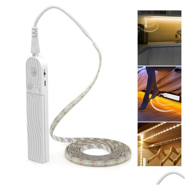 Strisce LED Strisce luminose Sensore di movimento 1M 2M Nastro luminoso per armadio sotto il letto Lampada Corda notturna per scale Corridoio Armadio Cucina Goccia Deli Dhr2C