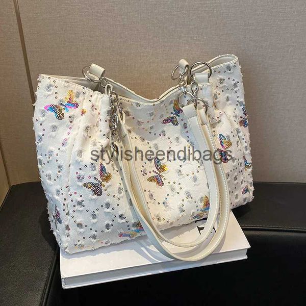 Bolsas de ombro bolsas bolsas femininas 2023 primavera/verão grande capacidade de ombro de ombro de lantejoulas de borboleta de jeans handbagstylisheendibags