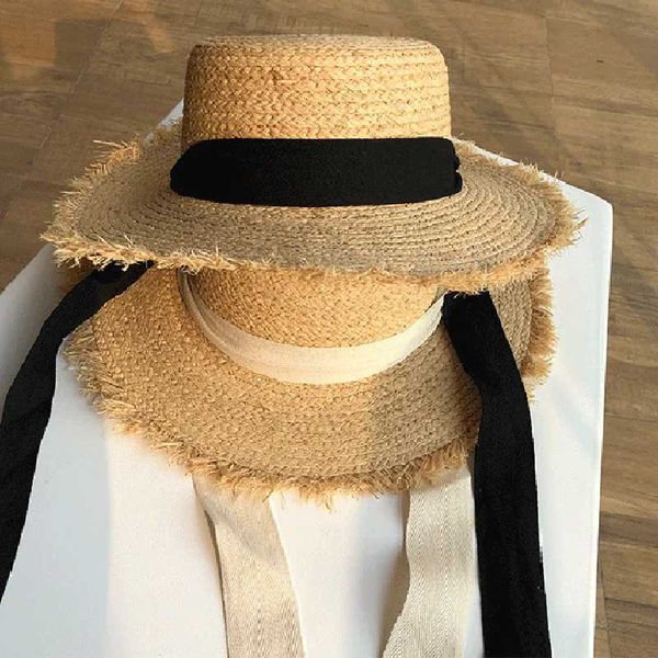 Cappello di paglia da donna a tesa larga protezione solare da spiaggia berretto con fiocco in nastro bianco e nero casual da donna flat top Panama 230920