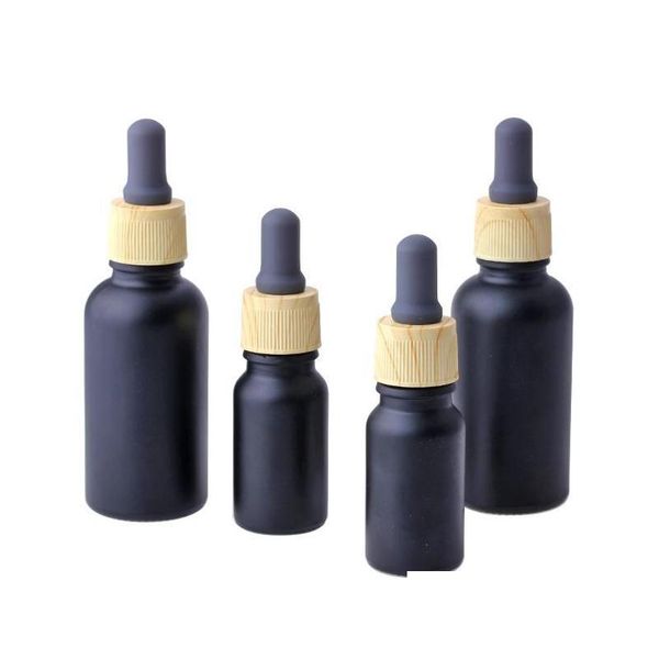 Bottiglie di imballaggio all'ingrosso olio di fumo nero opaco e vetro liquido essenziale per bottiglia contagocce pipetta reagente con venatura del legno Drop Deliv Dhxpv