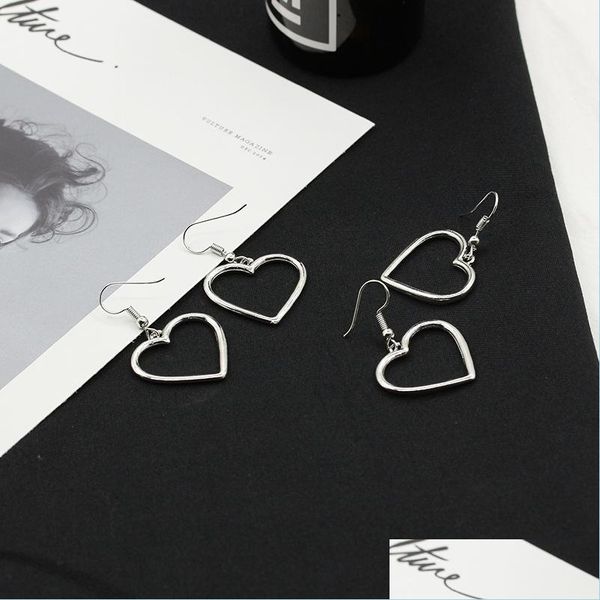 Dangle Chandelier Design Simple Sier Color Hollow Heart Groftings para mulheres Novas marca Moda Ear punho de puercing Dangle Brincho G Dhqeu