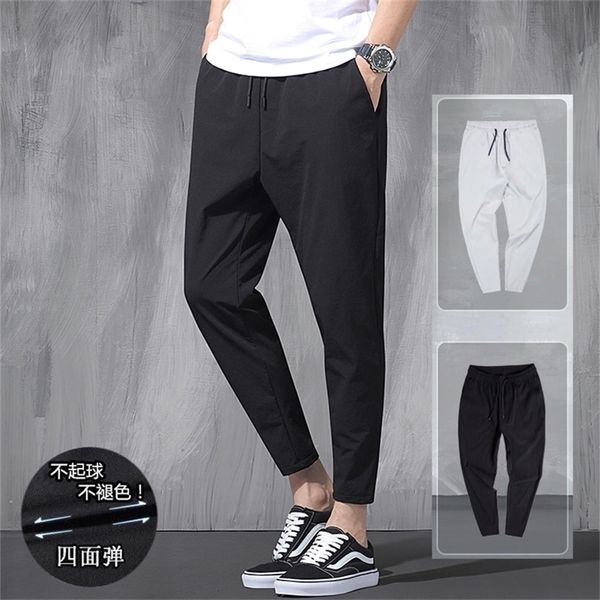 Мужские брюки корейские шелковые шелковые эластичные брюки Четыре сезона тонкие повседневные мужские свободные 9point крупные спортивные брюки для ног весна 220922