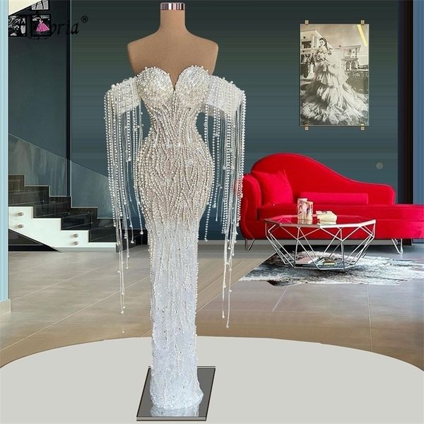 Abiti da festa Eleganti perle piene Abito da sera a sirena con perline Bianco con spalle scoperte Nappe Lunghezza pavimento Abito trasparente da ballo Robe De Soiree 220923