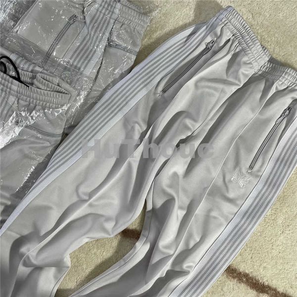 Мужские брюки белые полосы иглы для спортивных штатов мужчины 1 1 Высотая вышитая бабочка Awge Игл штаны T221206