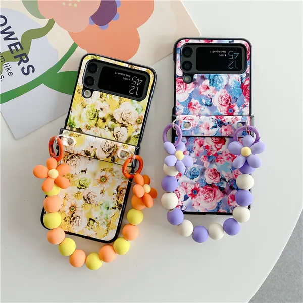 Custodie per telefoni con bracciale pieghevole con fiori per Samsung Galaxy Z Flip3 Flip4 5G Guscio protettivo in pelle rosa Vogue corda antiurto