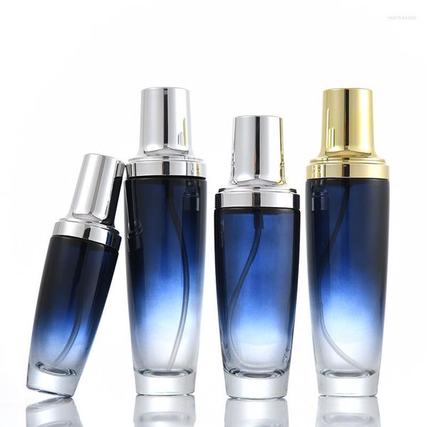 Bottiglie di stoccaggio Flacone per lozione in vetro blu da 100 ml Pompa oro / argento / spruzzatore Siero / emulsione / lozione / fondotinta / toner Imballaggio cosmetico sbiancante