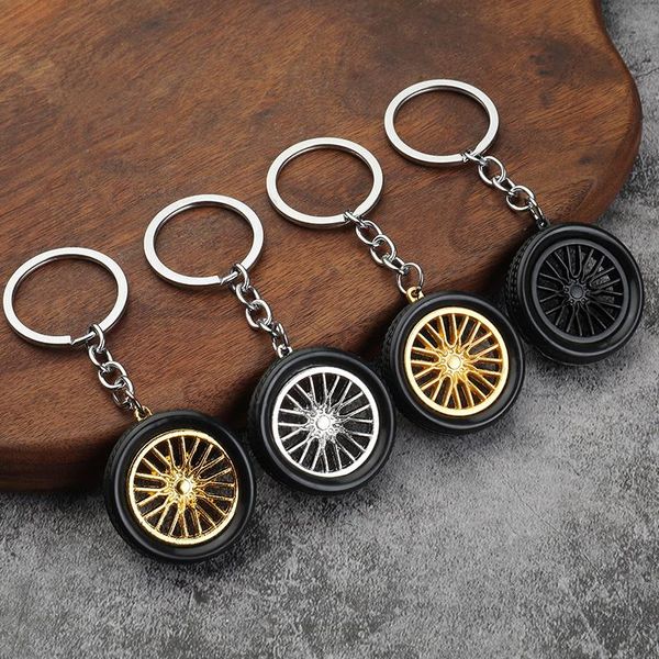 L'automobile della lega dell'ORLO di Keychain del mozzo di rotella dell'automobile del PVC spinge la catena chiave sveglia