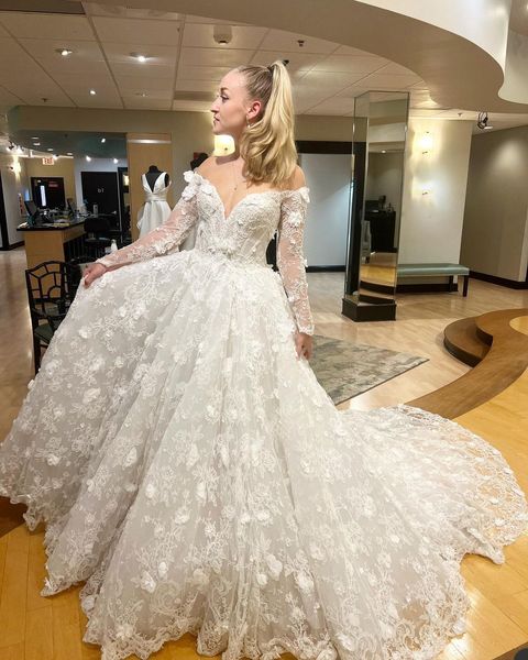 2023 Splendidi abiti da sposa A Line Country Jewel Neck Illusion Off spalla Maniche lunghe Appliques in pizzo Perline Fiori fatti a mano Abiti da sposa formali Sheer Back