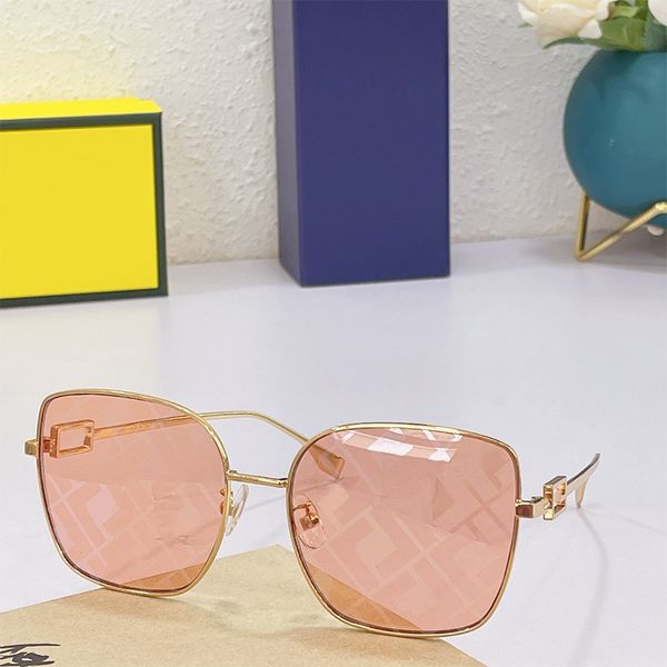 Sonnenbrille OL006 mit braunen Gläsern und Logo. Übergroße quadratische Baguette-Sonnenbrille. Metallgold verspiegelte Farbtöne. Hohles Logo, Luxus-Designer-Party Adumbral
