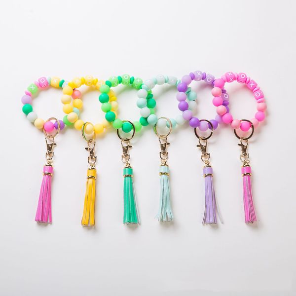 Chaços europeus e americanos Chaves transfronteiriça de pulseira fluorescente luminosa nicho de berço de silicone Pu Tassel Breads Bracelete Nightclub Chain Key Chain