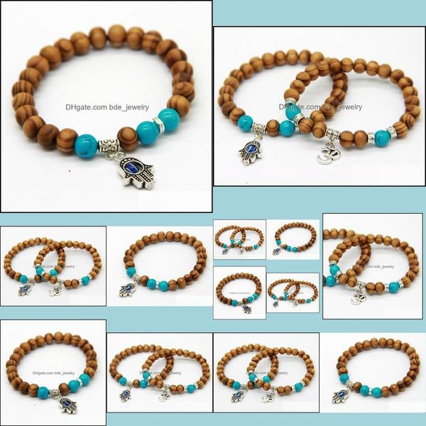 Braccialetti con ciondoli Prodotti Qualità all'ingrosso 8Mm Perline di legno con perline Fatima Hand Hamsa Bracciali Om Yoga Gioielli Drop Delivery Dhxif