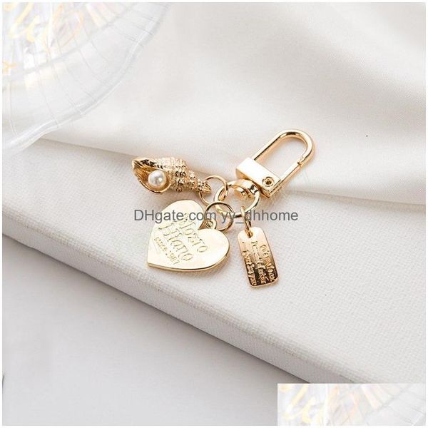 Principais anéis adoráveis ​​mulheres meninas cardíaco pingente de casca de chaves key titular menina anel carta carta rótulo de chaves de chaves de chaves dhnre dhnre