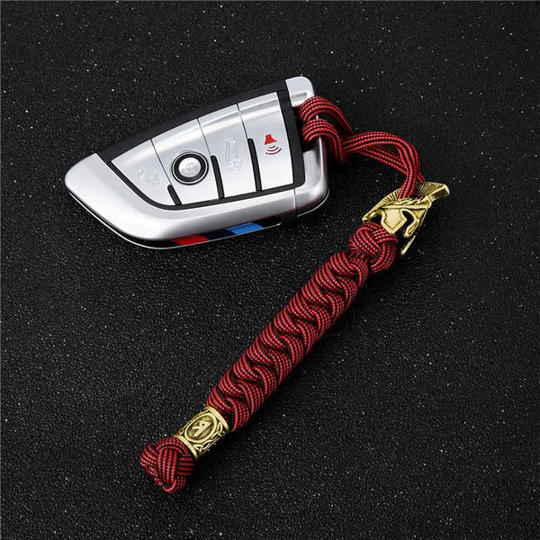 Schlüsselanhänger Antike Goldfarbe Wikinger Runenperle Schlüsselanhänger Vintage Spartan Warrior Metall Handgefertigt gewebt Survival Paracord Seil Auto Schlüsselanhänger G221026