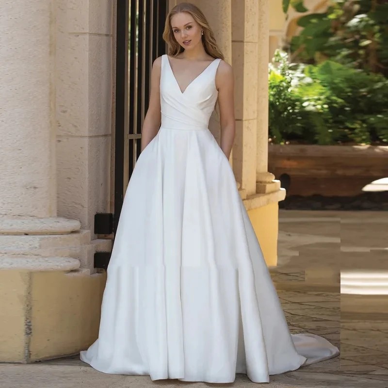 Elegant V Neck Satin A Line Wedding Dresses With Pockets Boho Garden Sleeveless Simple Bridal Gowns Sweep Train Backless Buttons Bride Modern Robes de Mariee CL3171
