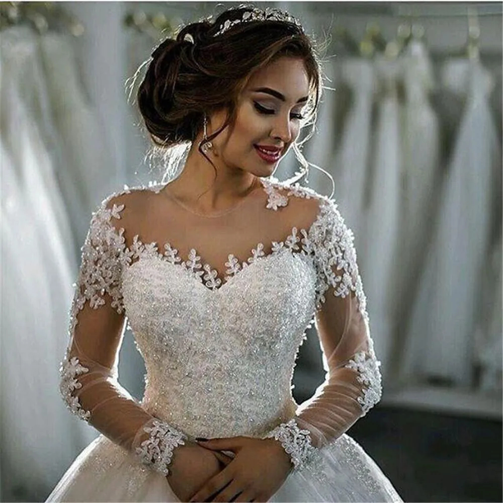 2024 Princess Long Sleeves Ball Gown Wedding Dresses Lace Appliques Beaded Arabic Dubai Ivory Tulle Bridal Gowns Back Buttons Chapel Train Robe De Mariee