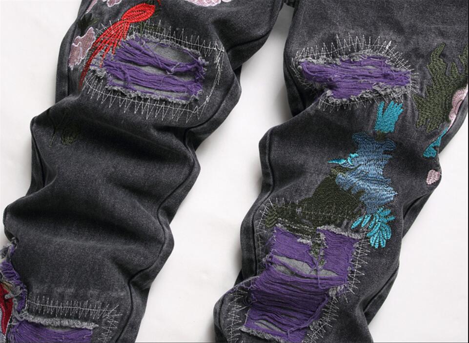 Hip-Hop Men Men Drukowane dżinsy dżinsowe dżinsy stretch Streetwear Streetwear Skull Pleins Flame Painted Spodnie Vintage Buttons Fly Slim Rised Spodni Oryginalny projekt