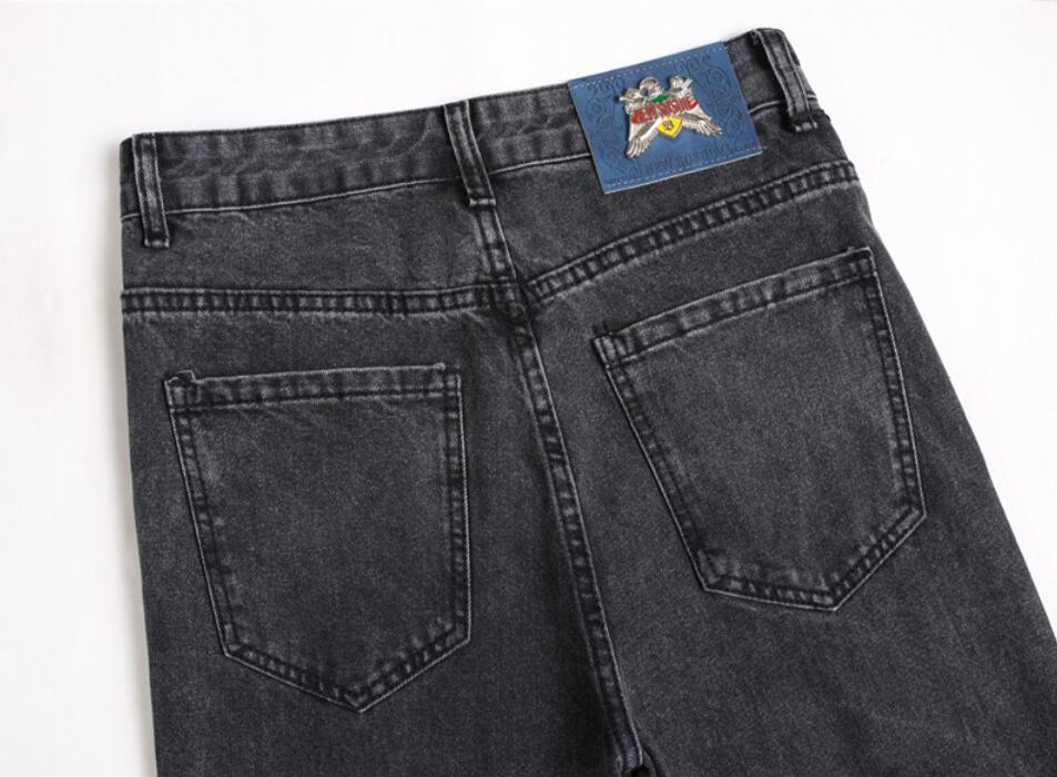 West Coast hip-hop Uomo Jeans denim elasticizzati stampati Streetwear Personaggio Teschio pleins Pantaloni dipinti a fiamma Bottoni vintage Pantaloni slim strappati design originale