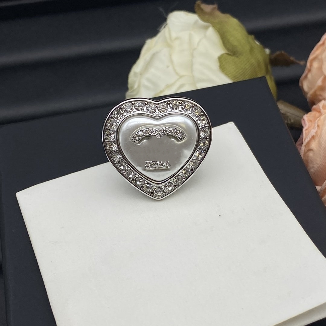 Anillo de diseño de lujo de alta calidad para mujer hombre Joyería de diseño Anillos de pareja Anillos de banda de perlas de titanio chapados en oro de 18 quilates para anillo de bodas Regalo de joyería de aniversario