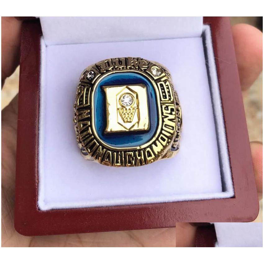 Med sidogenar Duke Blue 2001 Devils National Team Championship Ring trälåda män fan souvenir gåva grossist droppleverans juvel dhu3k